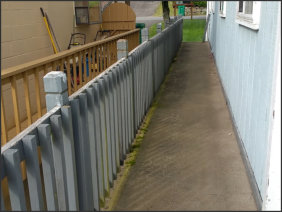 Replaced siding and railing: before